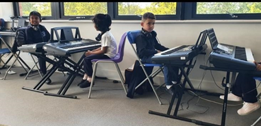 Children playing on keyboards