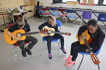 Children playing on guitars