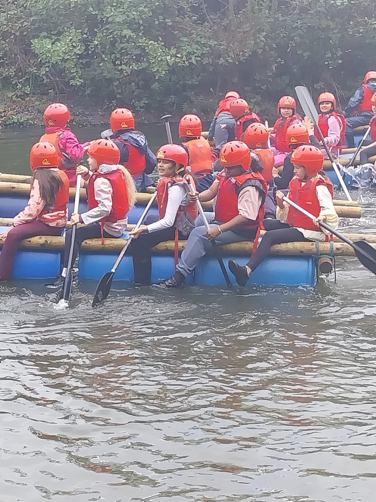 Some children on a raft in the water