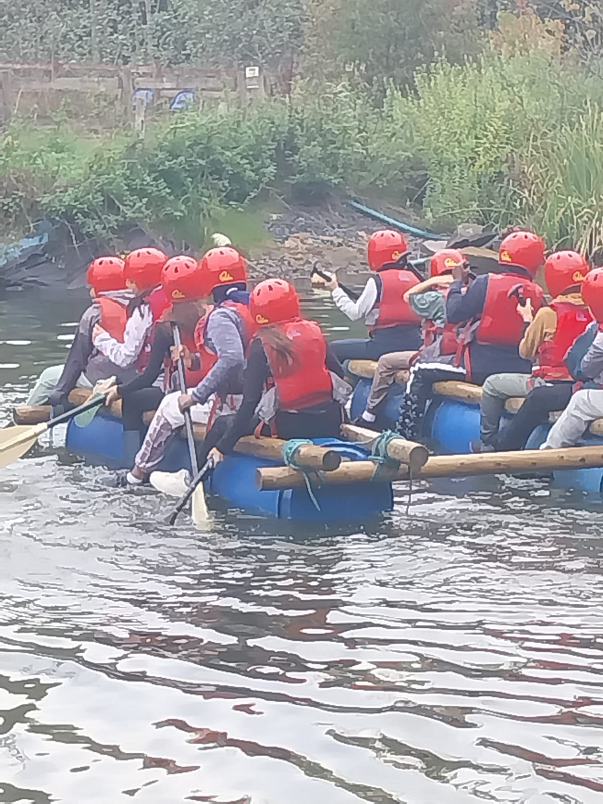 Some children on a raft in the water