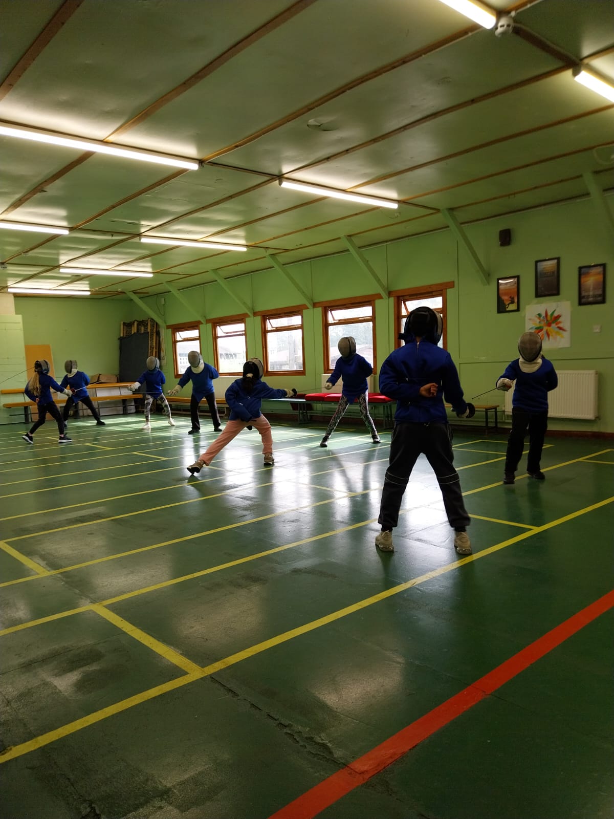 Group of children fencing