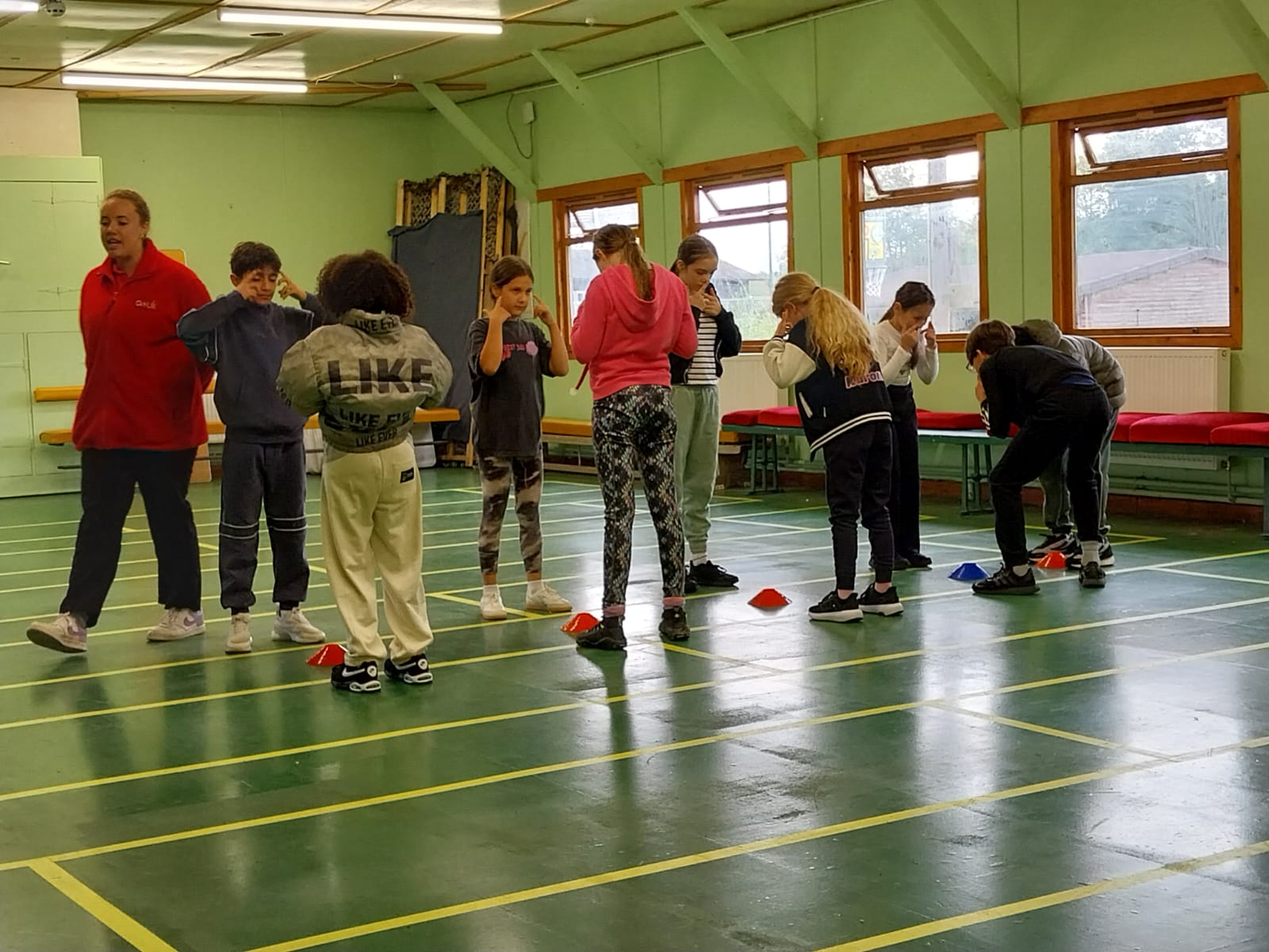Group of children practicing fencing techniques 