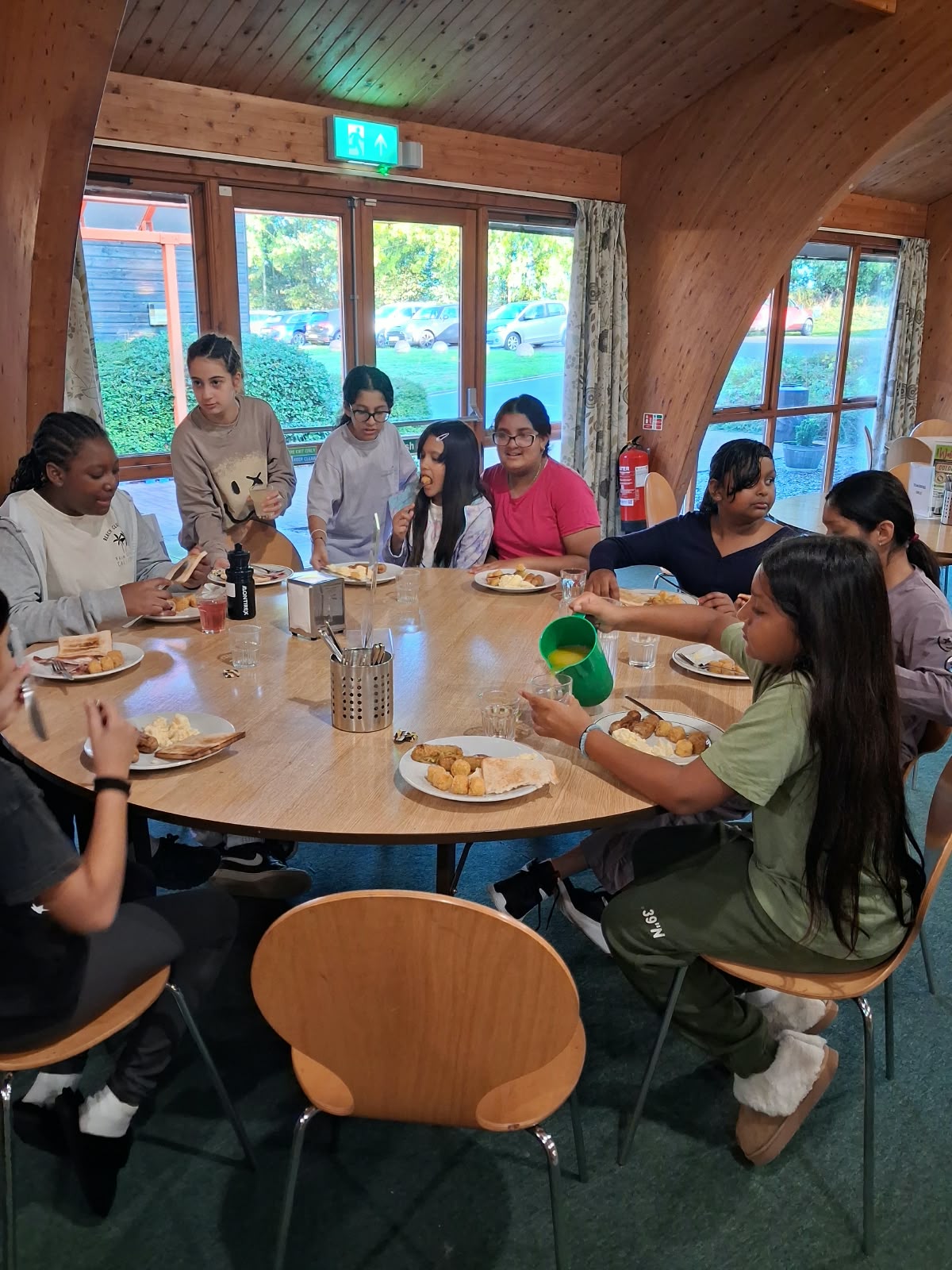 Year 5 & 6 children eating breakfast