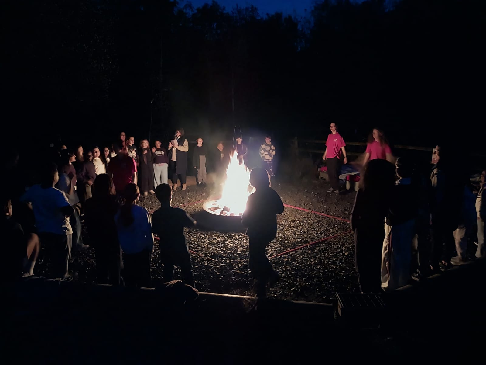 Year 5 & 6 children around a campfire