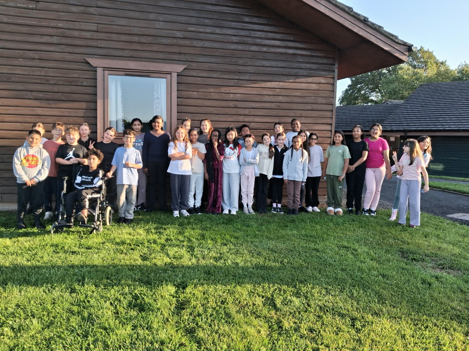 Year 5 & 6 children outside their lodge