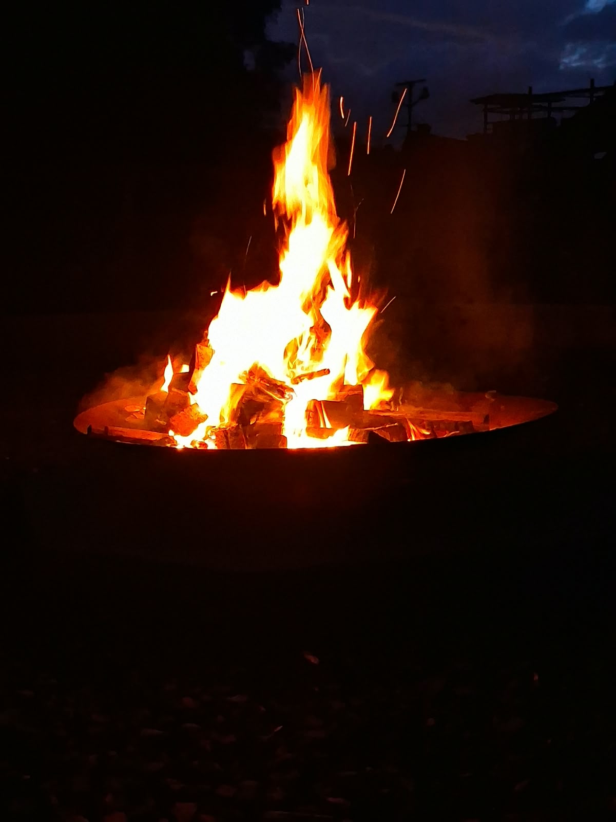 Year 5 & 6 children around a campfire