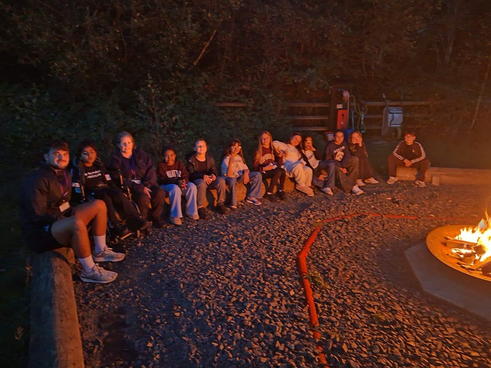 Year 5 & 6 children around a campfire