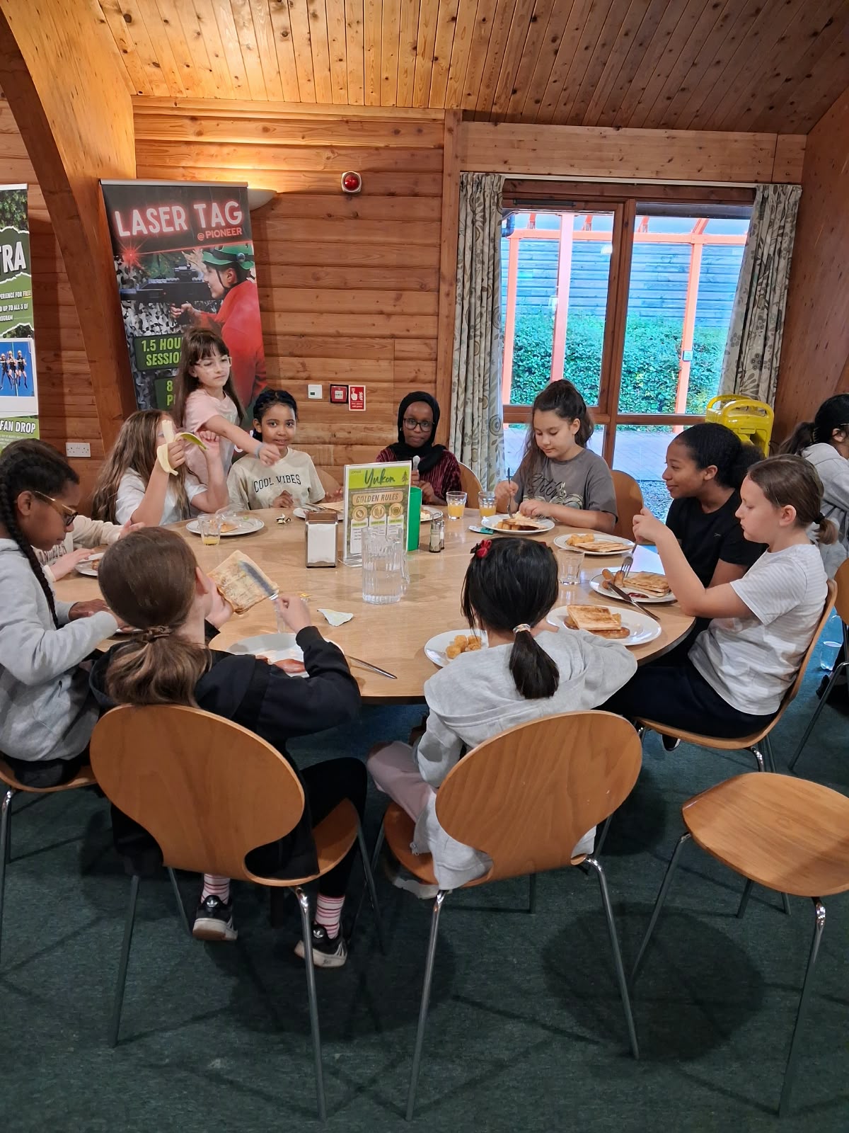 Year 5 & 6 children eating breakfast